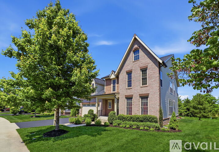 A house with a tree in front of it.