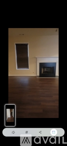 A room with a fireplace and a window.