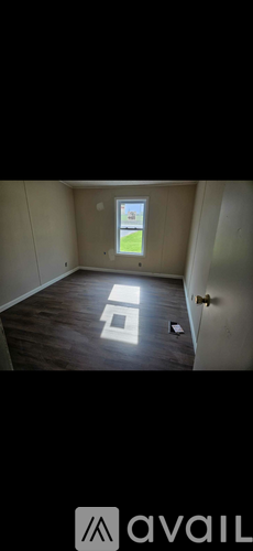 A room with a window and a door.