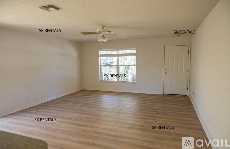 A room with SK Rentals written on the wall.
