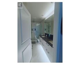 A bathroom with a sink and mirror.