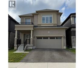 A two-story house with a garage is numbered 25.