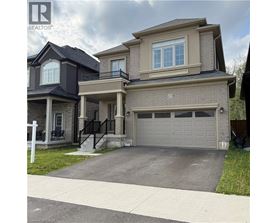 A two-story house with a garage is for sale.
