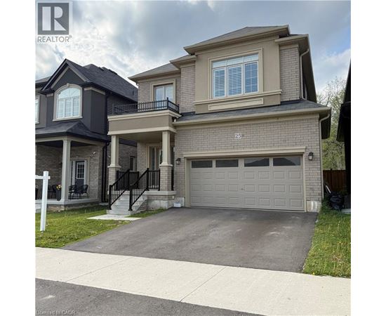 A two-story house with a garage is for sale.
