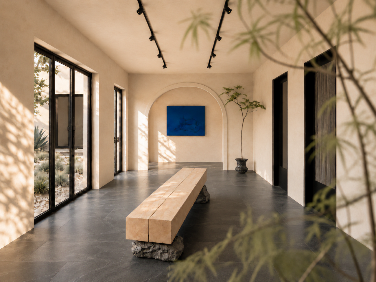 A long wooden bench sits in the middle of a room with a large screen on the wall.