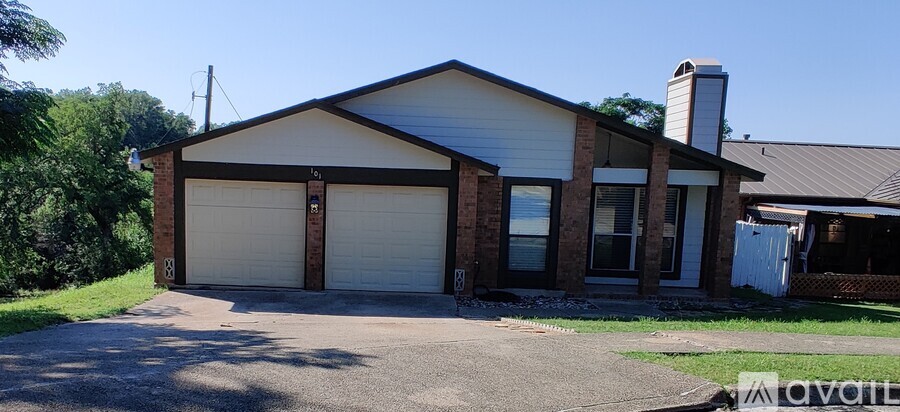 A two-car garage with a brick chimney is available for rent.