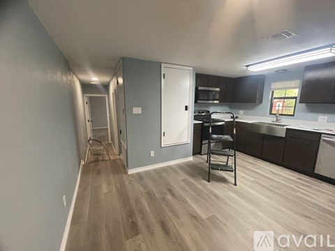 A kitchen with a dining table and chairs is available for rent.
