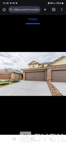 A house with a brown garage door and a driveway.