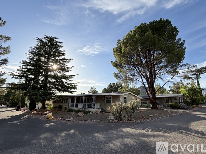 A sunny day at a residential area with houses and trees.