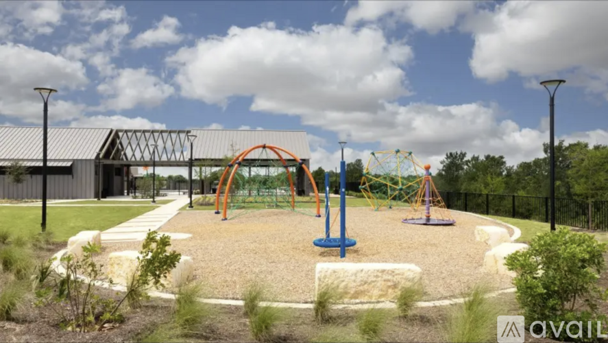 A playground with a swing set and a slide.