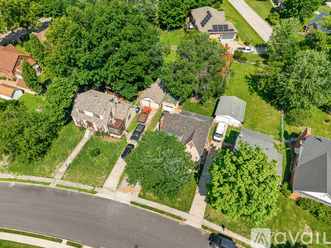 A bird's eye view of a residential area with houses and trees.