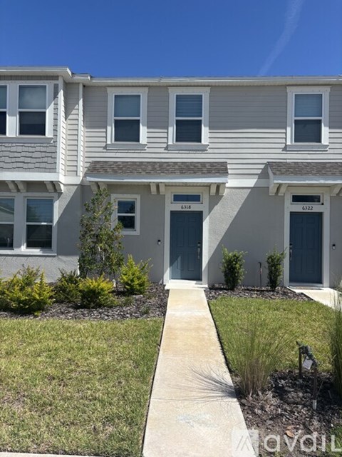 A row of houses with the numbers 4183 and 4182 on the doors.