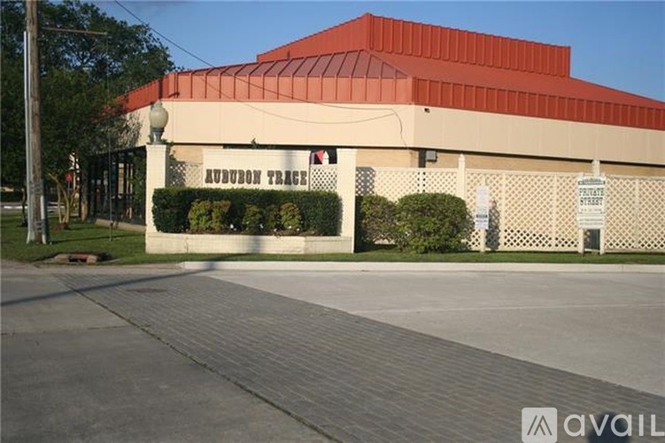 A building with a red roof and a sign that says "HUDSON TRADES".