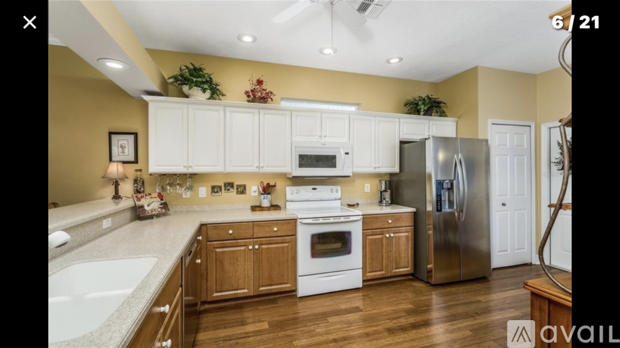 A kitchen with wooden cabinets and stainless steel appliances.