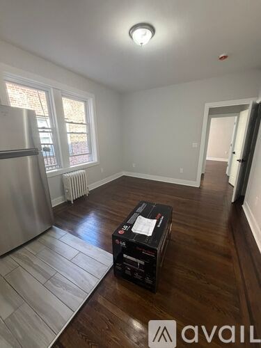 A room with a wooden floor and a box on it.