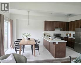 A modern kitchen with a dining table set for four.