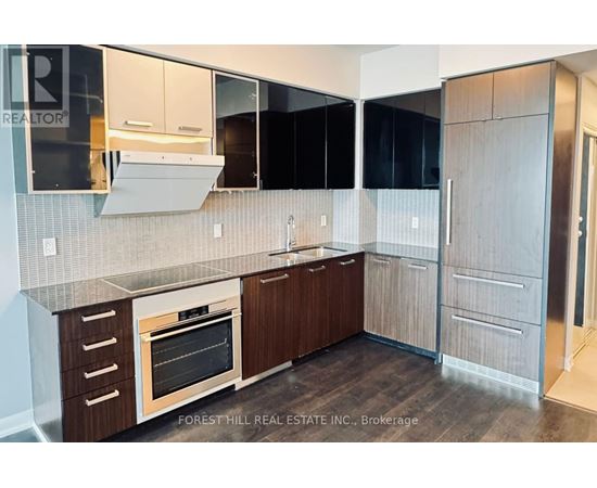 A kitchen with a wooden oven and cabinets.