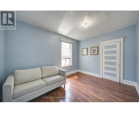 A living room with a couch and a door.