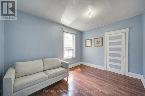 A living room with a couch and a door.