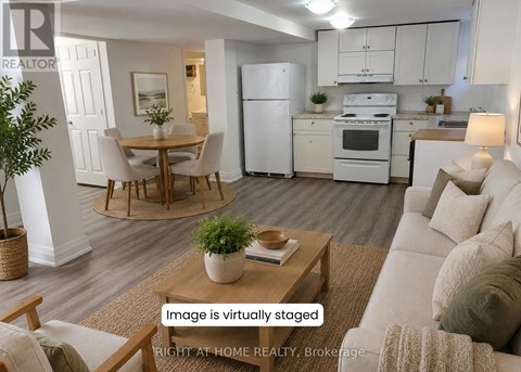 A virtual staged image of a modern kitchen and living room.