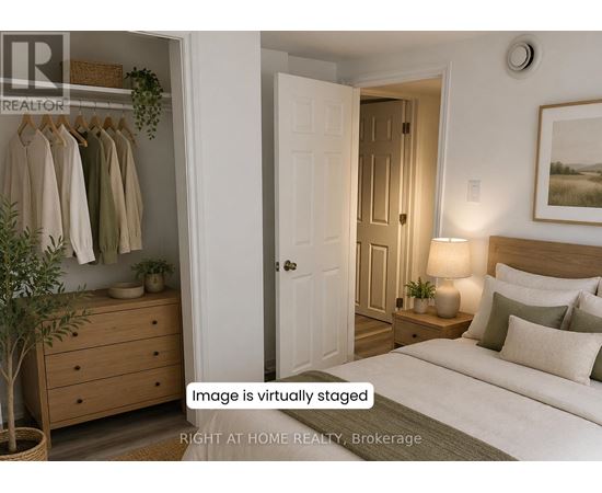 A virtual staged bedroom with a bed, nightstand, and a plant.