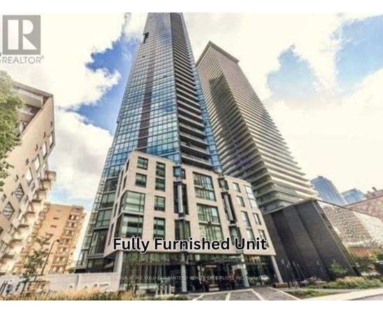 A tall, modern building with a glass facade is advertised as a fully furnished unit.