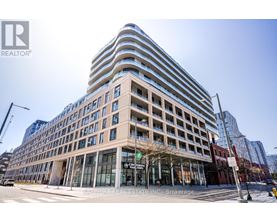 A modern building with a glass facade is the main focus of the image.