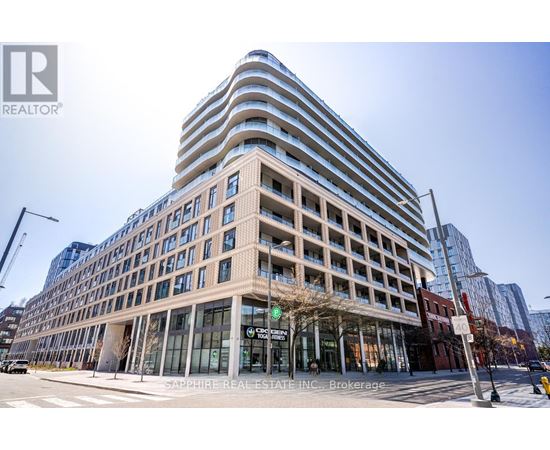 A modern building with a glass facade is the main focus of the image.