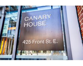 A sign for Canary House at 425 Front St. E.