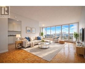 A living room with a couch, coffee table, and a television.