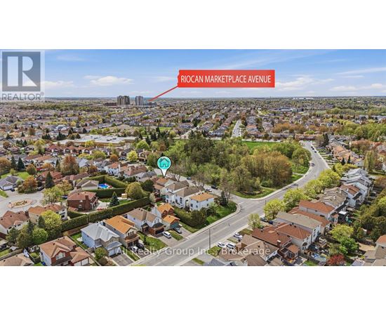 An aerial view of a residential area with a road labeled Roman Marketplace Avenue.