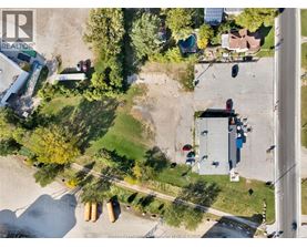 A Windsor Essex County Realtor logo is on an aerial image of a neighborhood.