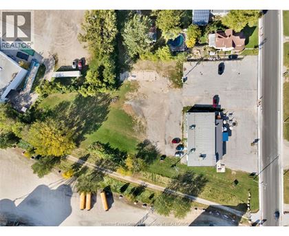 A Windsor Essex County Realtor logo is on an aerial image of a neighborhood.