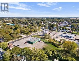 A bird's eye view of a town with a REALTOR® logo in the corner.