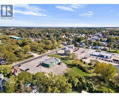 A bird's eye view of a town with a REALTOR® logo in the corner.