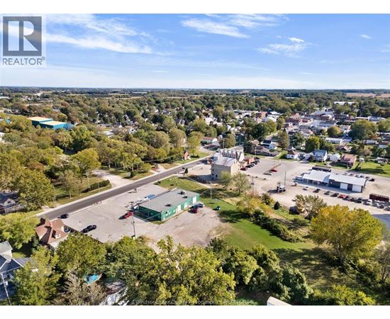 A bird's eye view of a town with a REALTOR® logo in the corner.