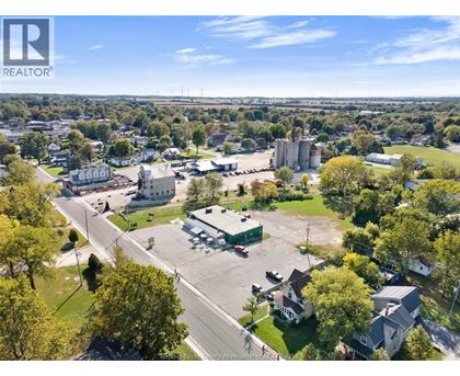 A bird's eye view of a town with a large building in the center.