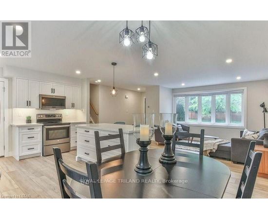 A well-lit dining area with a table set for two.
