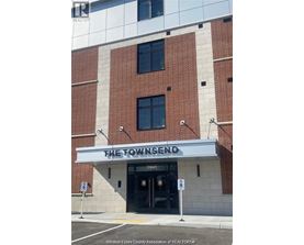 The front of a building with a sign that says The Townsend.