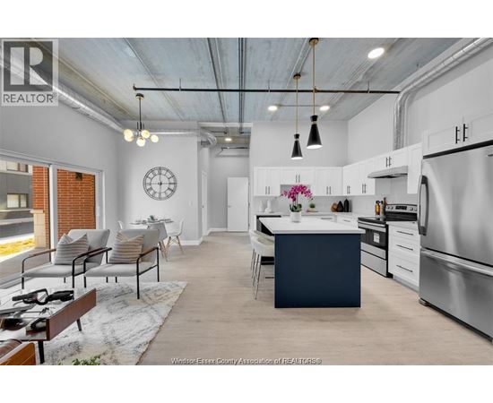 A modern kitchen with a dining area and a living room.