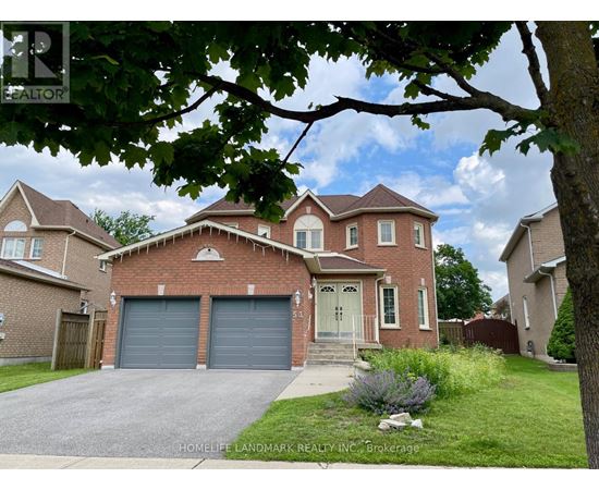 A large brick house with a garage is for sale.