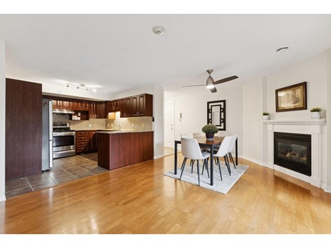 A modern kitchen with a dining table and chairs.