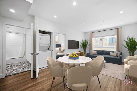 A modern living room with a dining table and chairs.