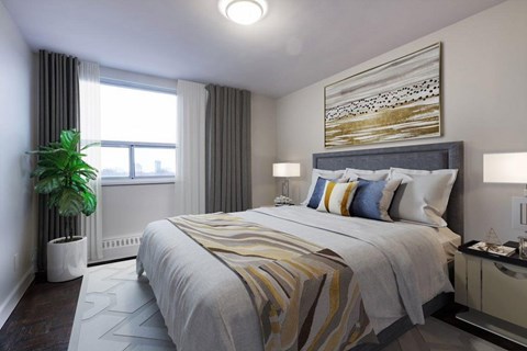A bedroom with a large bed and a painting on the wall.