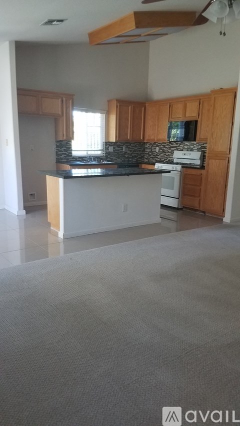 A kitchen with a counter top and cabinets.