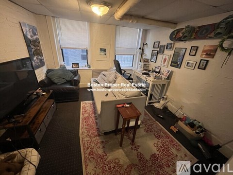 A room with a bed, a desk, and a chair is available for rent.