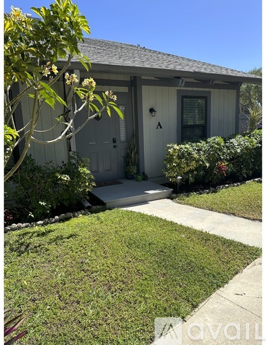 A house with a white door and a small porch.