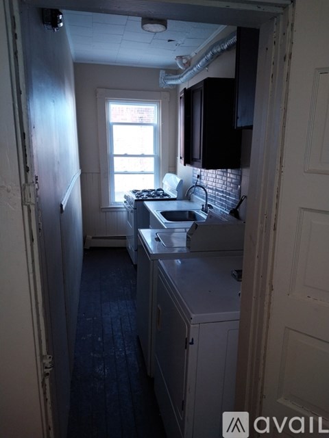 A kitchen with a sink and a window.