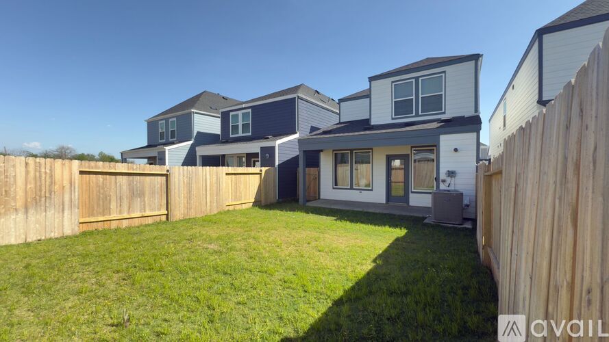 A house with a blue and white exterior is available for sale.