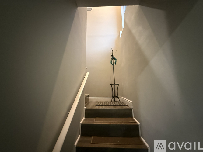 A staircase with a light at the top.